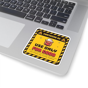 May include: A square sticker with a yellow background and black diagonal warning stripes along the border. It features a pixelated character wearing a white hat and holding a red heart, with the text CONTAINS AI, USE ONLY FOR GOOD, and side effects may include kindness.