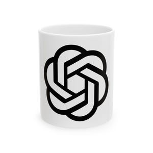 Może przedstawiać: Biały ceramiczny kubek do kawy z czarnym geometrycznym wzorem. Wzór to sześcioczęściowy, zazębiający się kształt. Kubek jest cylindryczny i ma gładkie, błyszczące wykończenie.