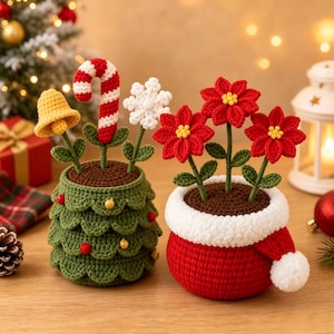May include: Two crocheted potted plants. One is a green tree-shaped pot with a yellow bell, red and white candy cane, and white snowflake. The other is a red pot with a white trim and three red poinsettia flowers with yellow centres.