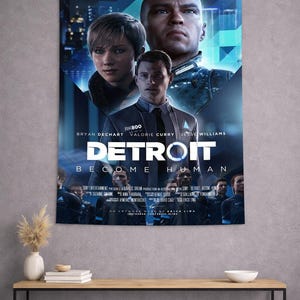May include: A wall tapestry featuring the "Detroit: Become Human" video game. The poster-style design includes the game's title, character portraits, and the tagline "How far will you go to be free?" The tapestry is displayed above a wooden table.
