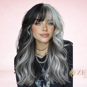 May include: A long, wavy wig with a split design, featuring black and silver-gray strands. The wig has a side part with bangs. The person is wearing a black top and layered necklaces. The ZELYA Wigs logo is in the bottom right corner.