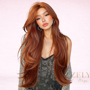 May include: A woman with long, layered auburn hair. She is wearing a black top and a leopard print jacket. The image has a soft, pink background. The text "ZELYA Wigs" is visible in the bottom right corner.