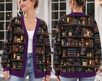 May include: A long-sleeved button-down cardigan featuring a dark, all-over print of bookshelves filled with books, candles, potted plants, crystals, a black cat wearing a purple witch hat, a skull, and a cauldron, finished with purple trim.