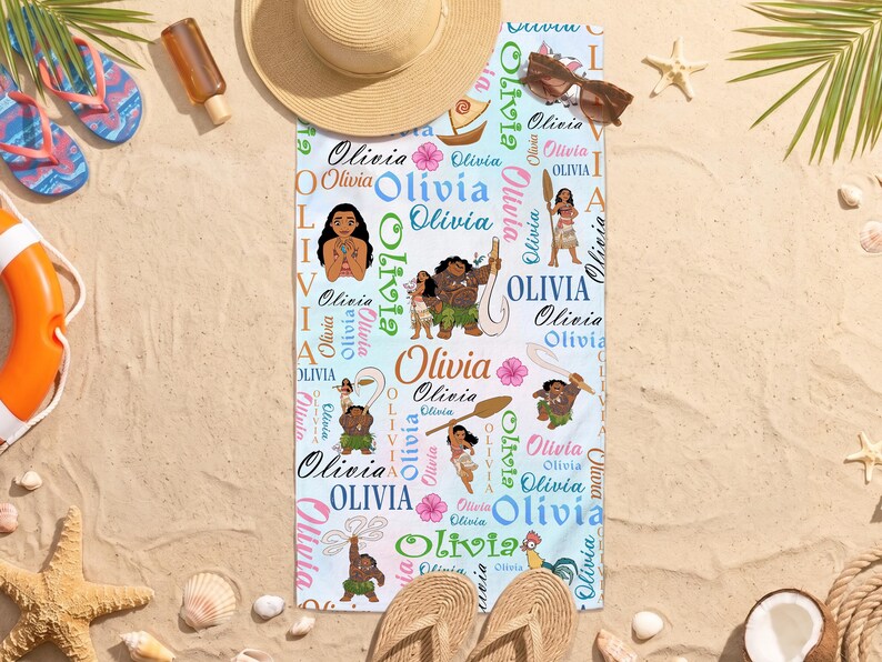 May include: A rectangular beach towel featuring a repeating pattern of the name Olivia in various fonts and colors, interspersed with illustrations of characters from the movie Moana, including Moana, Maui, Pua, and Heihei, on a light blue background.
