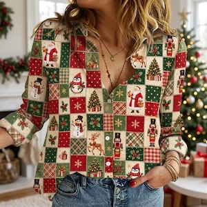 May include: A long-sleeve button-down shirt featuring a festive patchwork pattern of red, green, and cream squares. The print includes illustrations of Santa Claus, nutcrackers, snowmen, reindeer, penguins, Christmas trees, and snowflakes.