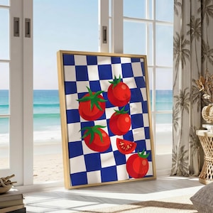 May include: A rectangular framed wall art piece featuring a vibrant blue and white checkered pattern background. The artwork displays four whole red tomatoes with green stems and one sliced tomato segment arranged across the checkered surface.