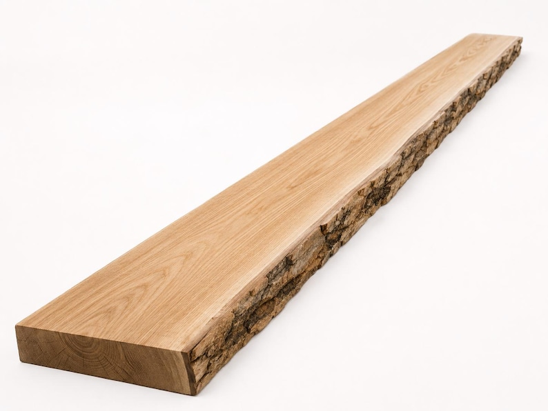 May include: A long, rectangular wooden shelf featuring a smooth, light brown finished top surface with a visible wood grain pattern and one side edge left in its natural, rough, and textured bark state, showcasing the raw edge of the timber.