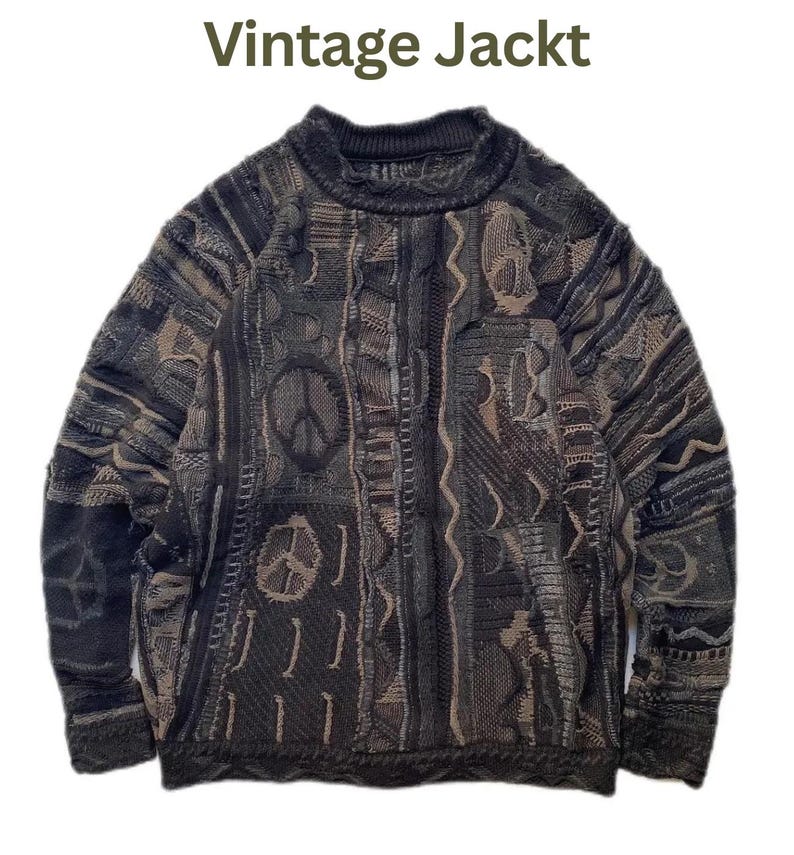 May include: A long-sleeve knit sweater featuring a dark gray and brown textured pattern with multiple peace sign symbols integrated into the design. The text "Vintage Jackt" is printed in dark green above the sweater on a white background.