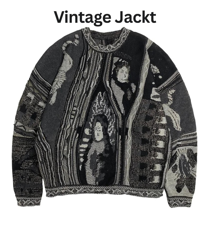 May include: A long-sleeve knit sweater in shades of black, gray, and white featuring the text "Vintage Jackt" at the top. The garment displays a complex, multi-panel jacquard pattern with abstract shapes, textured vertical stripes, and human figures.