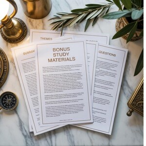 May include: Study materials with the text "BONUS STUDY MATERIALS" in gold. The papers are arranged on a marble surface, with a compass, a brass lamp, and a small plant in the background. The papers have gold borders and titles, with the word "QUESTIONS" visible.