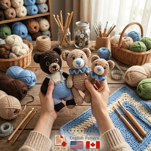May include: Three handmade crochet teddy bears in brown and tan colors. One bear wears blue overalls, and the other two have blue ruffled collars. The bears are held in front of a wooden table with yarn, crochet hooks, and a blue and white crochet square.