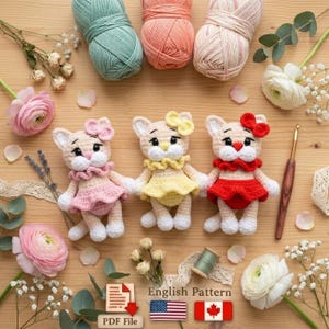 May include: Three handmade crochet cat dolls in pink, yellow, and red dresses, each with a matching bow. The dolls are surrounded by yarn, flowers, and a crochet hook. The image includes a PDF file icon and the text "English Pattern".