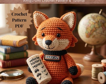 May include: An amigurumi crochet fox mascot with orange and cream yarn, wearing a black scarf with a CARFAX label. The fox holds a cream-coloured scroll labelled vehicle history report with car icons and checkmarks. Text reads CARFOX MASCOT.