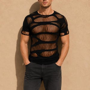 May include: A black short-sleeved t-shirt featuring a distressed design with large horizontal slashes and cutouts across the chest, shoulders, and torso, creating a semi-sheer, layered appearance with a round neckline and fitted silhouette.
