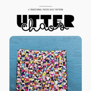 May include: A colorful quilt with a patchwork design, featuring a variety of geometric shapes in vibrant colors. The quilt is displayed against a blue wall. Text on the image reads "Utter Chaos" and "A Traditional Pieced Quilt Pattern."