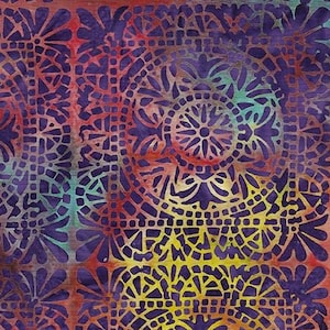 May include: Purple, yellow, and orange batik fabric with a repeating pattern of intricate geometric designs.
