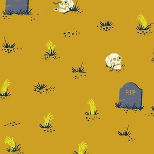 May include: A yellow fabric with a repeating pattern of skulls, hands, and tombstones. The tombstones have the word "RIP" on them.