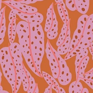 May include: An orange background with a repeating pattern of pink leaves with brown spots and pink veins. The leaves are elongated and have a rounded shape, creating a vibrant and eye-catching design. This pattern is suitable for fabric, wallpaper, or other decorative applications.