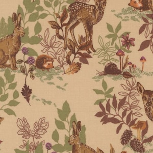 May include: A beige fabric with a woodland pattern featuring deer, rabbits, hedgehogs, snails, mushrooms, and foliage in shades of brown, green, and purple. The design has a vintage, storybook aesthetic.