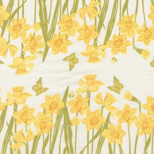May include: A repeating pattern of yellow daffodils and green butterflies on a white background. The daffodils are in full bloom, with detailed petals and orange centers. Green stems and leaves are interspersed among the flowers, with a green border.