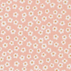 May include: A close-up of a fabric with a repeating pattern of small white flowers with yellow centers on a light coral background. The floral design is evenly spaced across the fabric.