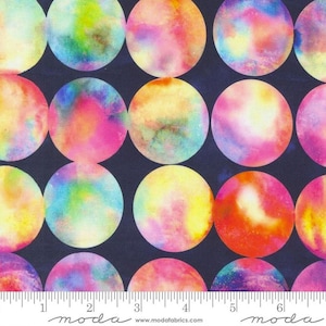 May include: A navy blue fabric with a repeating pattern of large, colorful circles. The circles are painted in shades of pink, yellow, blue, and green, creating a watercolor effect.