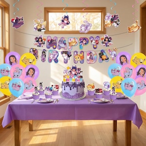 May include: A purple birthday party scene with a table set for a celebration. The table is covered with a purple tablecloth and decorated with balloons, a cake, cupcakes, and hanging decorations. The cake is purple with a Happy Birthday topper.