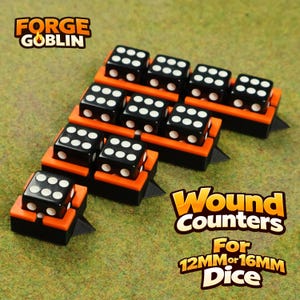 May include: Black dice with white dots arranged on orange and black wound counters. The image includes the text "FORGE GOBLIN" and "Wound Counters For 12MM or 16MM Dice". The dice are arranged on a green surface.