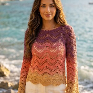 May include: A long-sleeved crochet sweater featuring a scalloped wave pattern in a gradient color scheme that transitions from deep purple at the neckline to coral pink in the center and finishes with a golden yellow hue at the hem and cuffs.