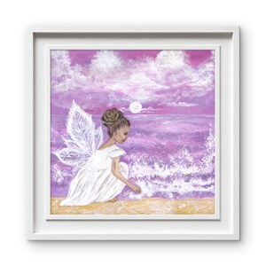 May include: A framed painting depicts a figure with translucent wings wearing a white dress, crouching on a sandy beach by a purple ocean. The scene features a bright moon in a cloudy sky, with white sea foam washing onto the shore in this artwork.
