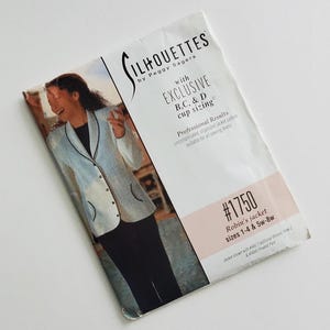 May include: A sewing pattern titled "SILHOUETTES by Peggy Sagers" for a Robin's jacket, sizes 1-4 and 5w-8w. The pattern features "EXCLUSIVE B,C, & D cup sizing." The cover shows a jacket with black pants. The pattern number is #1750.