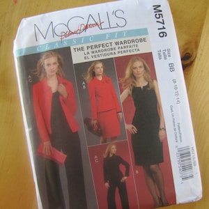 May include: A McCall's sewing pattern for a classic fit wardrobe. The pattern includes three different styles: a red blazer with black trousers, a red jacket with a black skirt, and a black dress. The pattern is for sizes 8-10-12-14.