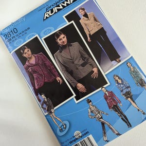 May include: A Simplicity 2810 sewing pattern envelope for a jacket, featuring the Project Runway logo. The blue package displays three photographs of jackets in different fabrics and colors, along with several fashion illustrations of the garment.