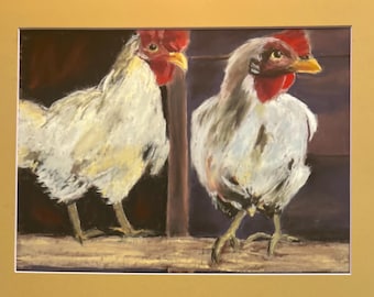 May include: An original pastel painting of two white roosters with red combs and yellow beaks. The artwork is set against a dark background with a wooden structure, and is framed with a gold mat.