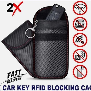 May include: Black carbon fiber car key RFID blocking cage with red stitching. The case holds a car key and has a key ring. The image includes icons indicating the case blocks signals. The text says "2X CAR KEY RFID BLOCKING CAGE".