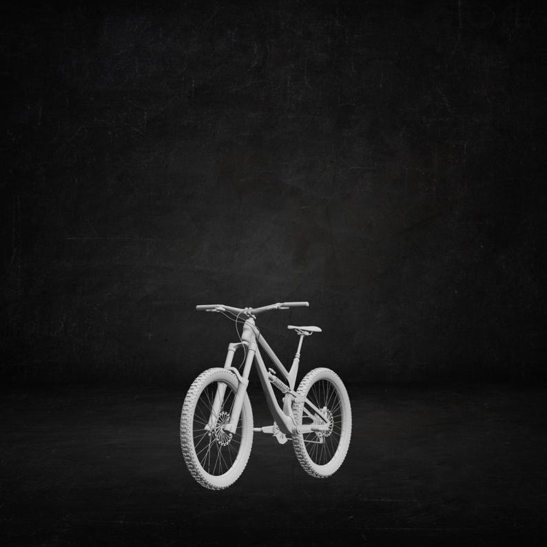 May include: A white mountain bike with chunky tyres and a suspension fork. The bike features a curved frame, a seat, and handlebars. The wheels have a detailed tread pattern. The background is a dark, textured surface.
