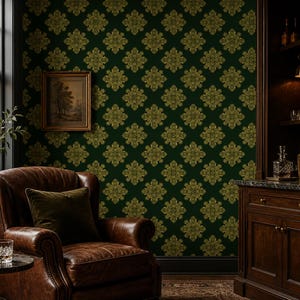 May include: Dark green wallpaper featuring a repeating gold damask pattern. The wall is adorned with a framed landscape painting. A brown leather armchair sits in front of the wall, accompanied by a small table with a glass decanter and tumbler.