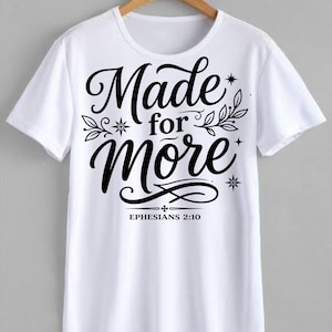May include: A white ceramic mug with a black handle and the text "But First, Coffee" in a black, handwritten-style font. The mug is on a white surface.