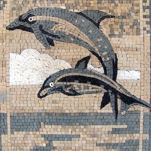 May include: A mosaic artwork depicting two dolphins leaping from the water. The dolphins are shades of gray and black, set against a background of beige, white, and gray tiles. The artwork is framed with a border.