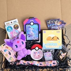 May include: A collection of Pokemon-themed merchandise including a purple plush toy, a plastic Poke Ball containing a small figure, a card display case with an Espeon card, a yellow box with Eevee art, a patterned lanyard, and various pins and cards.