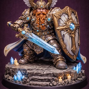 May include: A detailed figurine of a warrior in ornate armour, holding a glowing blue sword and shield. The figure has a long red beard, winged helmet, and is standing on a stone base with crystals and candles. The colour palette includes gold, blue, and silver.