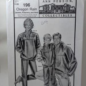 May include: A sewing pattern envelope titled Ann Person Collectibles 196 Oregon Rain for jackets, pullovers, and vests. The front features black and white illustrations of three people wearing these garments, with text indicating adult and children's chest sizes.