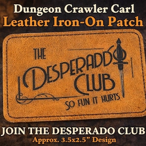 May include: A rectangular, brown leather iron-on patch with the text "THE DESPERADO CLUB" and a sword illustration. The patch also includes the text "SO FUN IT HURTS" and "JOIN THE DESPERADO CLUB!" The design is approximately 3.5x2.5 inches.