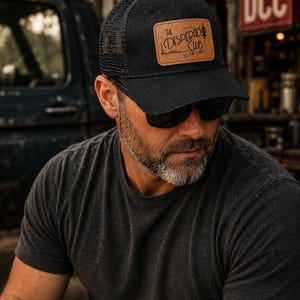 Dungeon Crawler Carl Trucker Hat – Leatherette Patch, Classic Fit