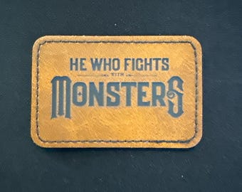 He Who Fights With Monsters Leatherette Patch, Iron-On (3x2 inches)
