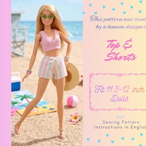 May include: A doll wearing a light pink sleeveless wrap top and white shorts with vertical pastel stripes. The doll has blonde hair, green sunglasses, and beaded bracelets and anklets. Text reads: This pattern was created by a human designer. Top & Shorts. Fit 29.2-30.5 cm Dolls. PDF Sewing Pattern Instructions in English.