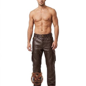May include: Brown leather cargo pants with multiple pockets. The pants have a classic design with a button and zipper closure. The leather has a slight sheen, and the pants appear to be well-tailored.