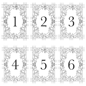 May include: Six black and white floral design cards, each featuring a number from one to six. The numbers are in a bold font, centered within an oval frame. The frames are surrounded by a floral rose design.