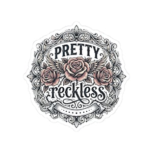May include: A sticker with a detailed floral design and the words "PRETTY reckless" in a decorative font. The design features three pink roses with wings, surrounded by ornate scrollwork in black and white.