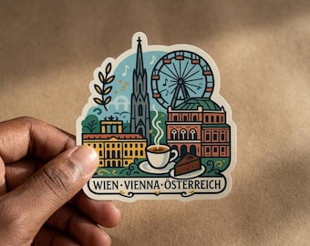 May include: A die-cut sticker featuring a colorful illustration of Vienna landmarks including a tall spire, a Ferris wheel, and historic buildings. A cup of coffee and a slice of cake are in the foreground. The text reads WIEN VIENNA ÖSTERREICH.
